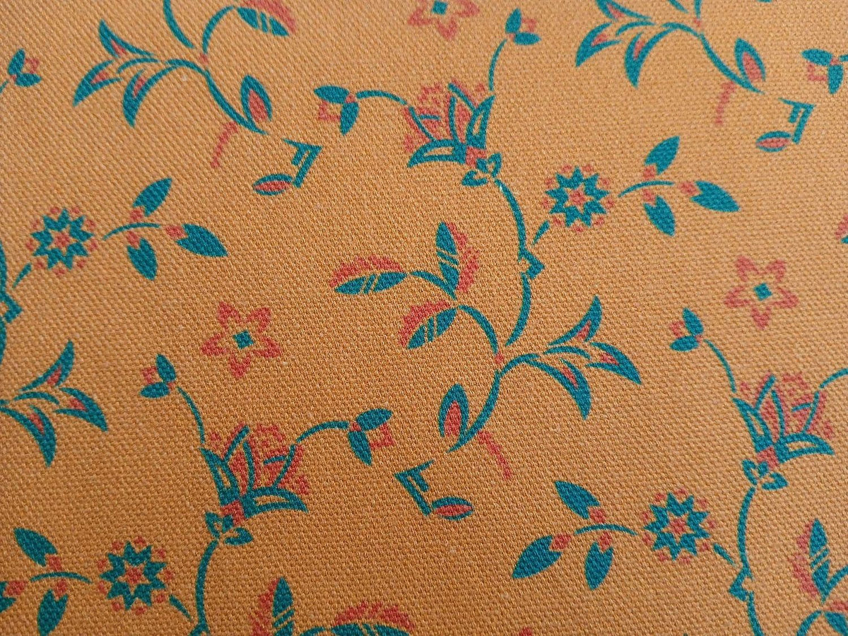 Halbpanama, Meterware, Baumwollstoff, Ockergelb mit Türkis und hellrot, Tanzende Disteln, Art deco